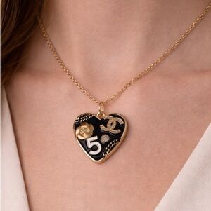 Chanel stamped Gold and Black Heart Pendant/ zipper pull/ charm